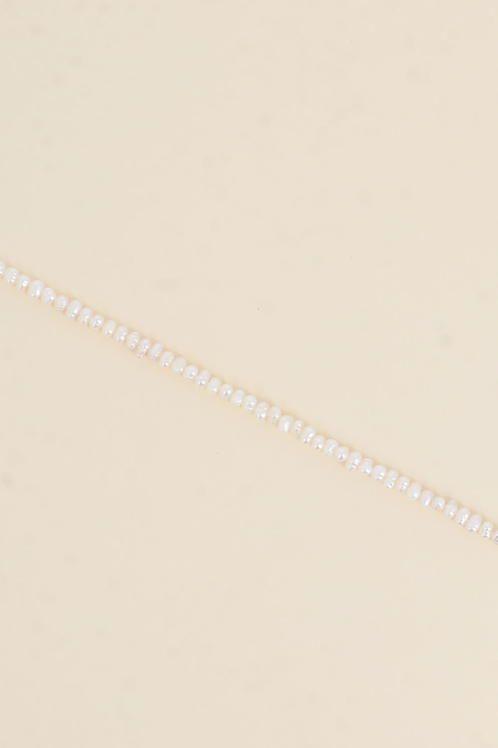 BRACELET SUR CORDON - PERLES D'EAU DOUCE