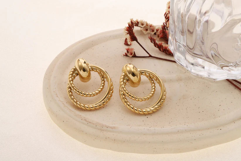 BOUCLES DOUBLES ANNEAUX TORSADES