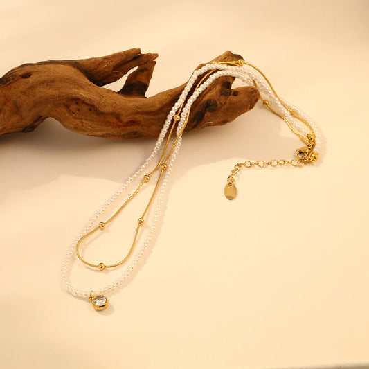 COLLIER DOUBLE CHAINE AVEC PERLE ET PENDENTIF STRASS
